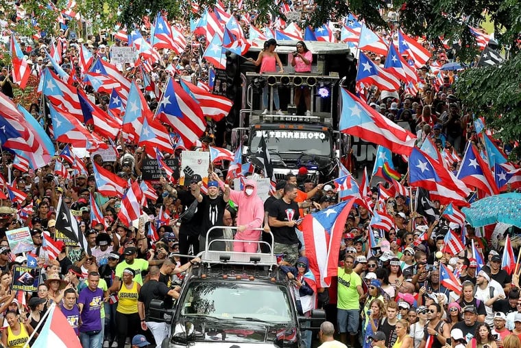Artists Residente and Bad Bunny joined a march along F.D. Roosevelt Avenue a day after Puerto Rico's governor Ricardo "Ricky" Antonio Rossello Nevares announced he will step down effective Aug. 2.