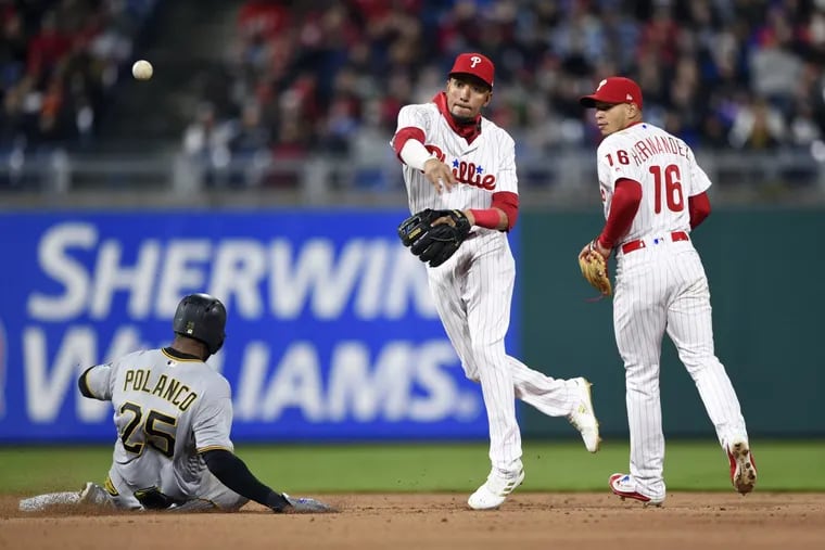 Phillies shortstop J.P. Crawford tries to turn two during the Phillies 2-1 win over the Pirates on Friday.
