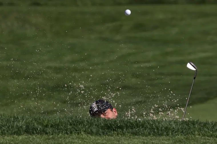 Francesco Molinari hits out of a bunker on the 11th hole during a practice round for the PGA Championship.