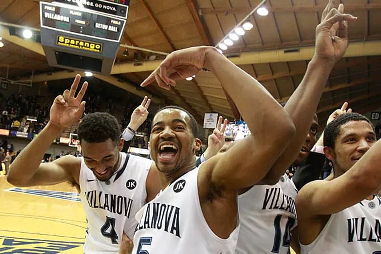 Darrun Hilliard (left) and Phil Booth celebrate after their victory. (Charles Fox/Staff Photographer)
