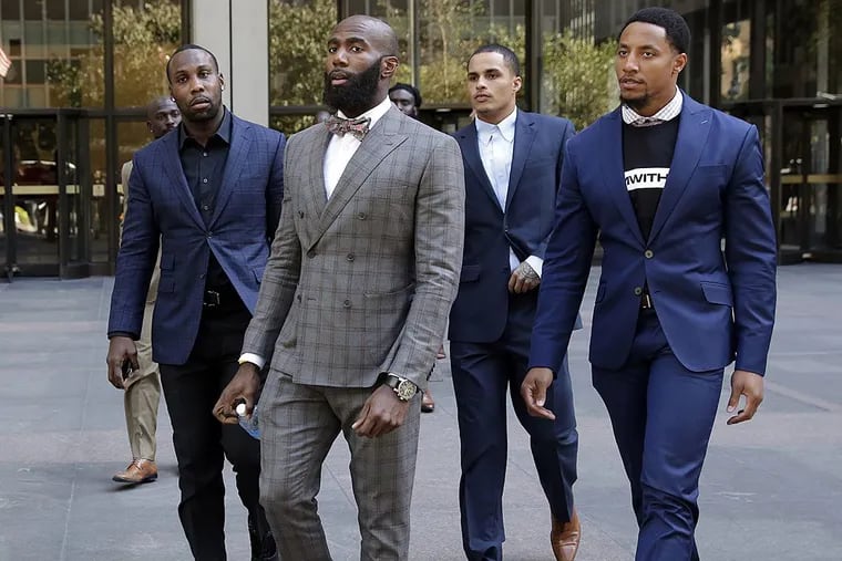 Former NFL football player Anquan Boldin, left, Philadelphia Eagles’ Malcolm Jenkins, second left, Miami Dolphins’ Kenny Stills, third left, and San Francisco 49ers’ Eric Reid, leave NFL headquarters after meetings, in New York, Tuesday, Oct. 17, 2017.