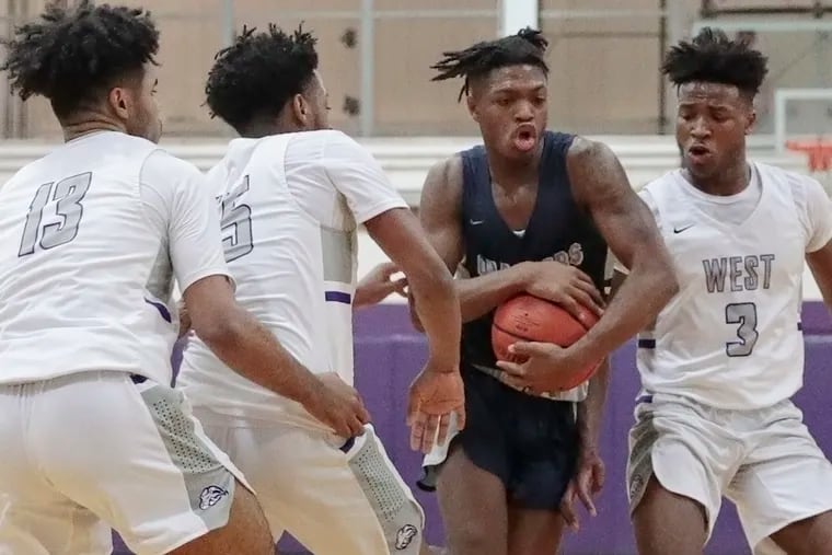 Timber Creek senior Eric Benjamin (with ball), shown here earlier this season vs. Cherry Hill West, and his teammates were one win away from the school's first state title in boys' basketball. The NJSIAA late Thursday canceled the state tournaments because of the coronavirus outbreak.