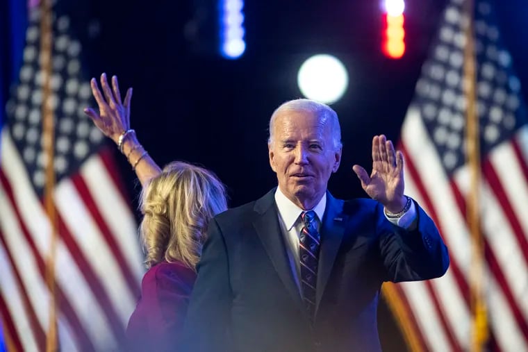 President Joe Biden and first lady Jill Biden wave during an appearance at Montgomery County Community College in Blue Bell on Jan. 5, 2024.