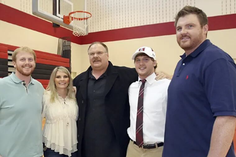 Andy Reid with wife Tammy as their son Spencer signs a letter of intent to play football at Temple University during a press conference at Harriton High School in Feb. 2011. The family group (left to right) is Britt, Tammy, Andy, Spencer and Garrett. (Steven M. Falk / Staff)