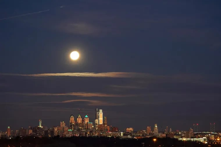 The Super Blue Moon sets over the Philadelphia skyline Wednesday January 31, 2018.