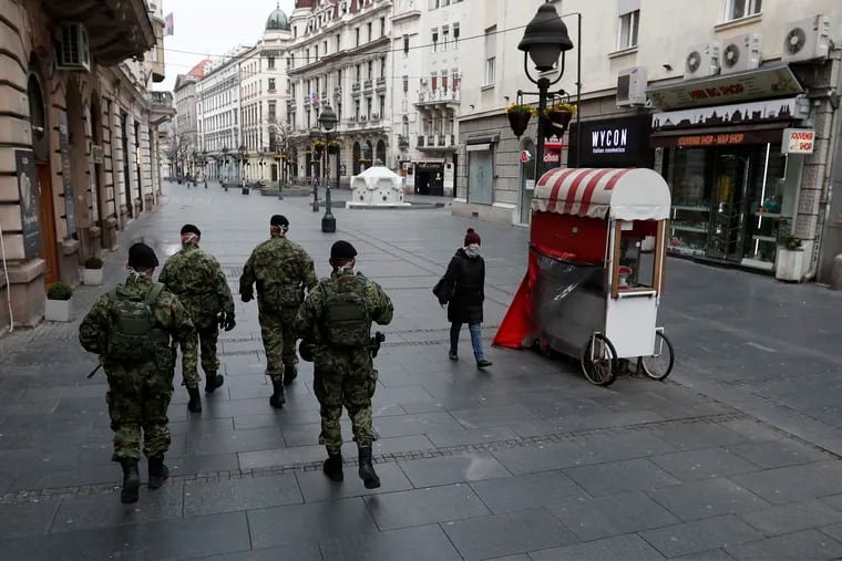 Serbian army soldiers patrol in Belgrade's main pedestrian street.