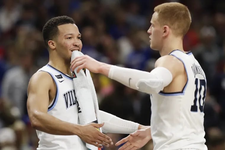Villanova guard Jalen Brunson and guard Donte DiVincenzo celebrate their win over Kansas in the NCAA Basketball Championship semifinals game on Saturday, March 31, 2018 at the Alamodome in San Antonio.
