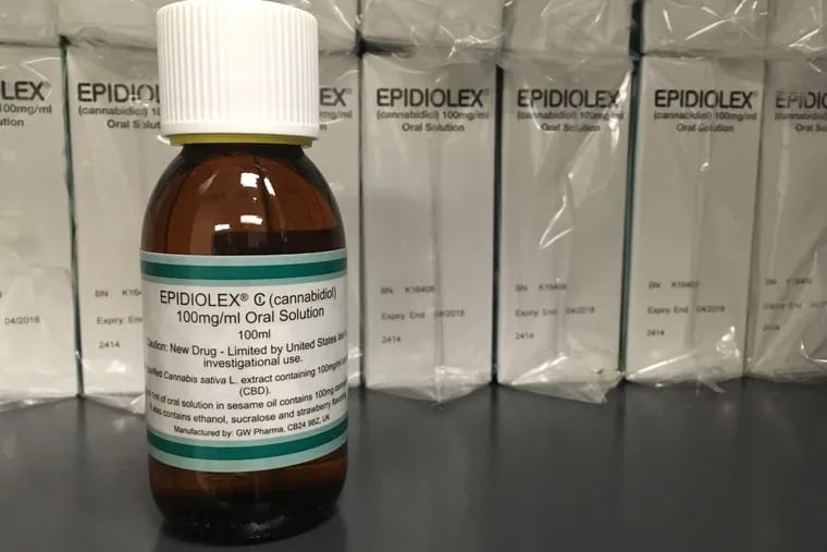 FILE – This May 23, 2017 file photo shows GW Pharmaceuticals' Epidiolex, a medicine made from the marijuana plant but without THC. Investors are craving marijuana stocks as Canada prepares to legalize pot next month, leading to giant gains for Canada-based companies listed on U.S. exchanges. (AP Photo/Kathy Young, File)