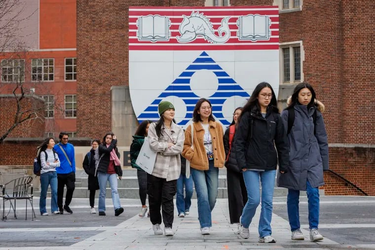 University of Pennsylvania students walking through Penn Commons, Monday, Dec. 11, 2023.