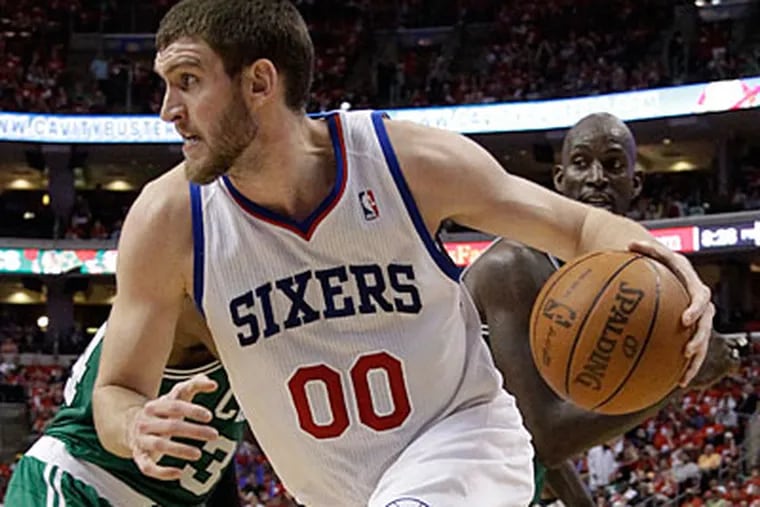 Spencer Hawes and the Sixers will play at Boardwalk Hall in Atlantic City on October 13. (Matt Slocum/AP)