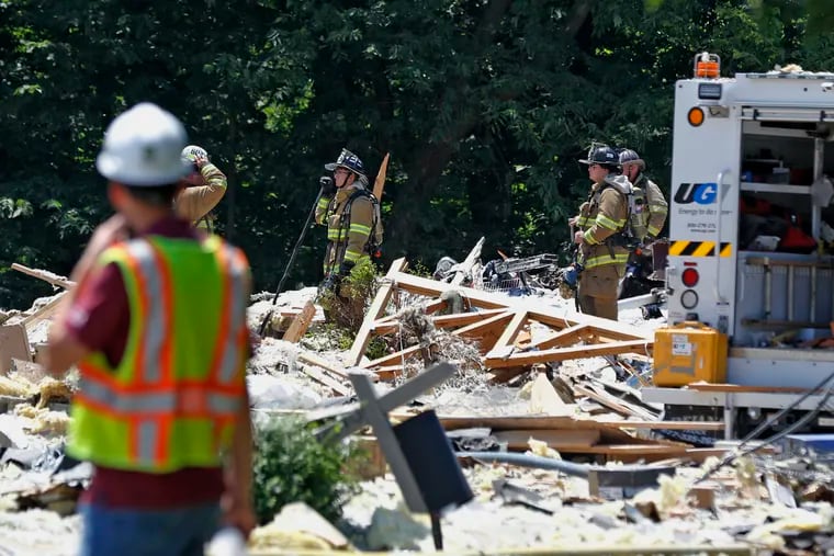 FILE - In this July 2, 2017, file photo, firefighters work the site of a house that exploded in Millersville, Pa.