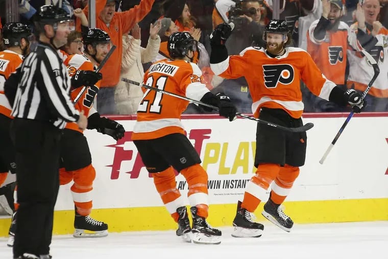 Flyers center Sean Couturier celebrates his game winning overtime goal with his teammates against the Toronto Maple Leafs on Saturday, January 6, 2018 in Philadelphia.