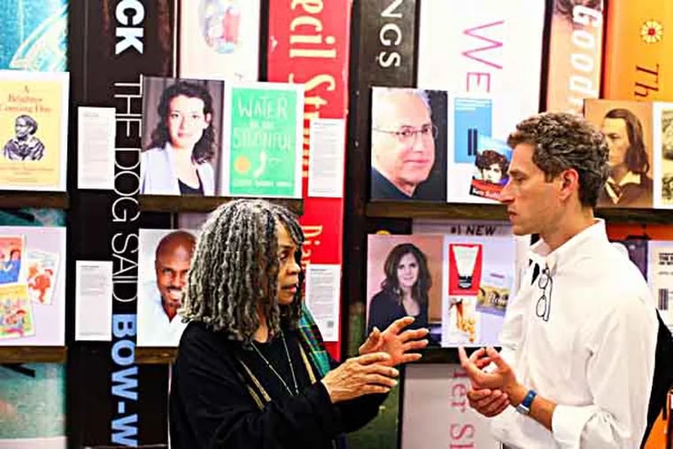Writer and poet, Sonya Sanchez speaks with Andy Kahan, from the Free Library of Philadelphia, at the unveili g of the Philadelphia Literary Legacy exhibit at the Philadelphia Airport, on Tuesday, June 2, 2013. ( Andrew Renneisen / Staff Photographer )