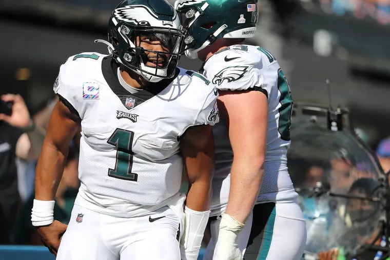 Philadelphia Eagles quarterback Jalen Hurts (left) celebrates with Philadelphia Eagles offensive tackle Jack Driscoll (right) after he scores a touchdown in the fourth quarter against the Panthers. Eagles win 21-18 over the Carolina Panthers in Charlotte, N.C. on October 10, 2021.