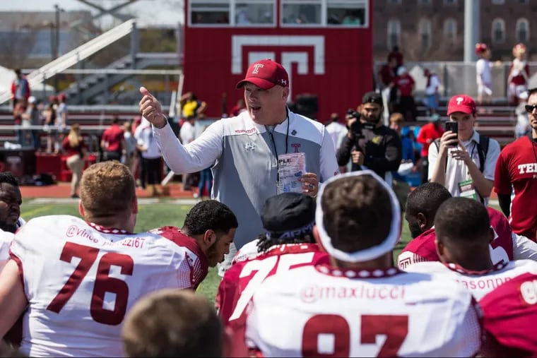 Temple football head coach Geoff Collins speaks with his players on the field after the Cherry and White game.