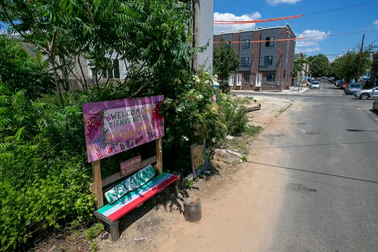 A sign for the Cesar Andreu Iglesias Community Garden on Lawrence Street looking north towards Norris Street on Monday, June 29, 2020.