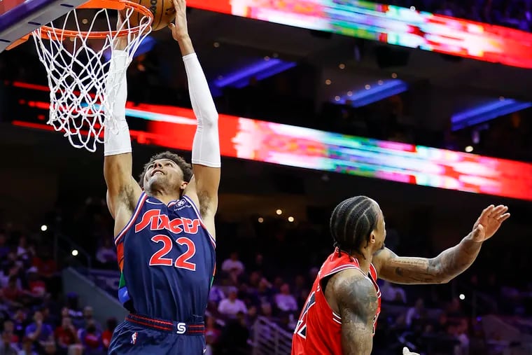 Sixers guard Matisse Thybulle dunks the basketball past Chicago Bulls forward DeMar DeRozan in the fourth quarter  on Monday, March 7, 2022 in Philadelphia.