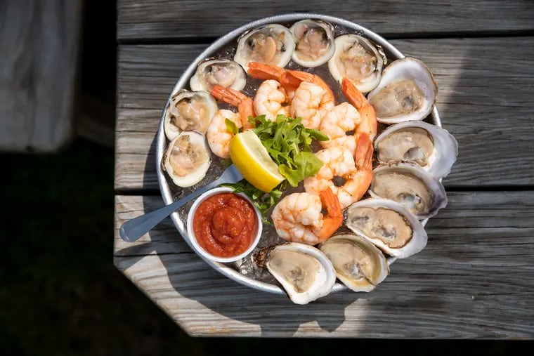 A raw bar platter with oysters, clams, and shrimp at Dock & Claw Clam Bar in Beach Haven, N.J., on Thursday, June 16, 2022. Dock & Claw is located at 506 Centre Street.