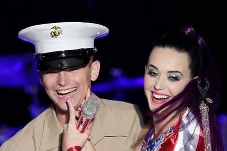 She&rsquo;s a grand ol&rsquo; flag

After a big battlefield victory, a Marine is all smiles during Pepsi&rsquo;s Fleet Week honoring U.S. service members in Brooklyn, N.Y., on Thursday. Nuzzling with singer Katy Perry &mdash; wrapped in the flag, no less &mdash; probably had something to do with the big grin, too. Katy sang "Part of Me" for the brave men (and women) in uniform.

Amanda Schwab/ Starpix