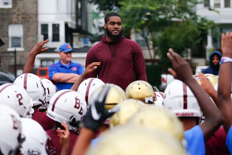 Shareef Miller, a recent Eagles draft pick and a former Philadelphia high school football player, talks to members of the Frankford High and Boys’ Latin Charter football teams during the recent Practice 4 Peace workout.
