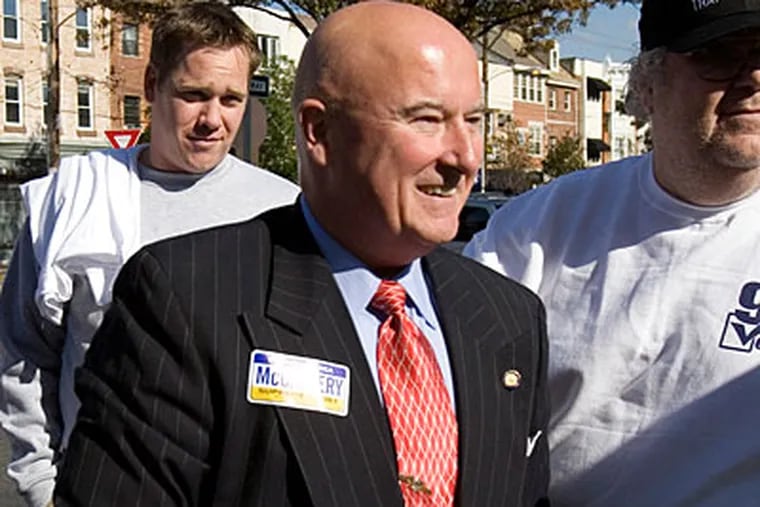 In this 2007 file photo, Seamus McCaffery, then a candidate for Pennsylvania Supreme Court, stands with supporters in Philadelphia. (ED HILLE / Inquirer Staff Photographer)