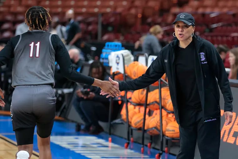 Coach Dawn Staley (right) has South Carolina in the Elite 8 of the NCAA Women's Tournament.