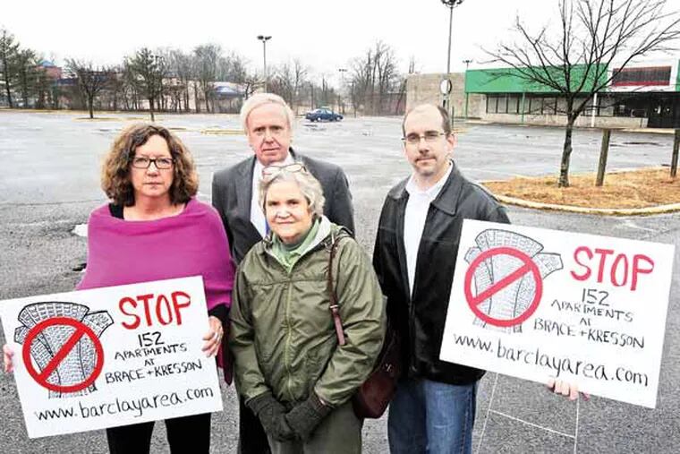 From left to right, at the proposed site for the apartments at Brace and Kresson Roads in Cherry Hill, are:  Martha Wright, Bert MacKay, Susan McNaughton, and Eric O'Dell. ( APRIL SAUL / Staff )