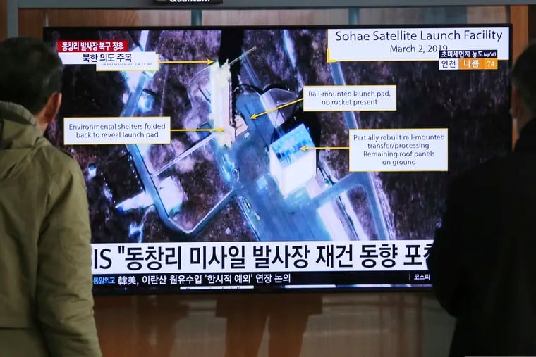 In this March 6, 2019, file photo, people watch a TV screen showing an image of the Sohae Satellite Launching Station in Tongchang-ri, North Korea, during a news program at the Seoul Railway Station in Seoul, South Korea.