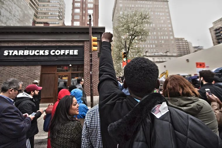 Protesters demonstrate outside the Starbucks at 18th &amp; Spruce Streets earlier this month.