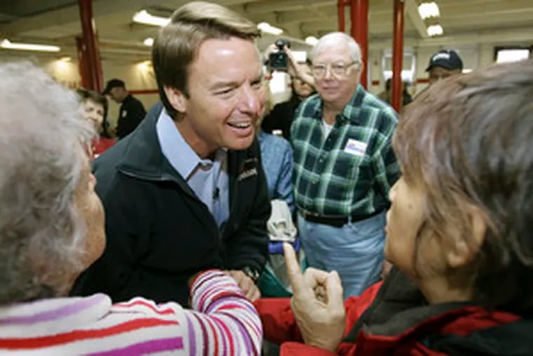 Former Sen. John Edwards of North Carolina, a Democratic presidential candidate, listens to questions during a campaign stop. He was at Laconia High School in Laconia, N.H., yesterday.