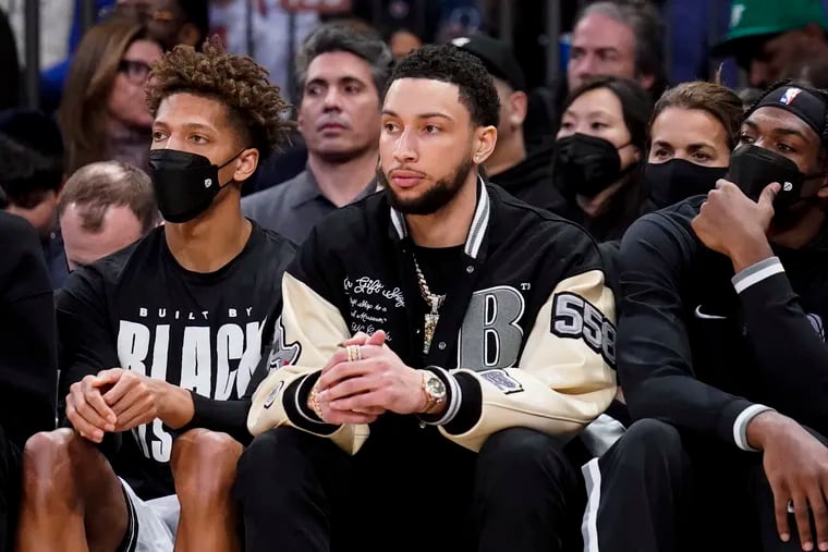 Brooklyn Nets forward Ben Simmons (middle) sitting on the bench during the second half against the New York Knicks on Feb. 16.