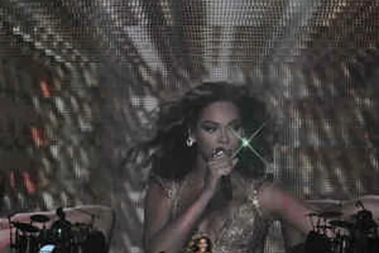 The opening of Beyonc&#0233; Knowles' concert Friday at the Wachovia Center, for last year's album &quot;I Am . . . Sasha Fierce.&quot; The whole show demonstrated her considerable skills as singer, dancer, bandleader, and - after several quick costume changes - a real clothes horse.