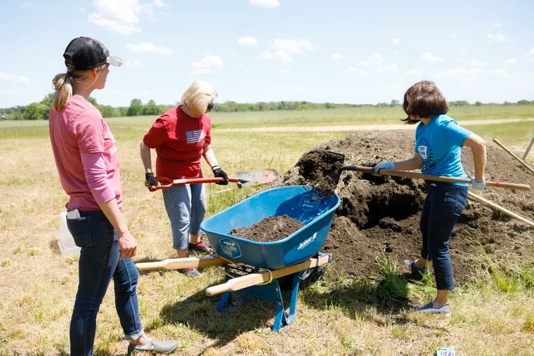 Volunteers plant a 'teaching garden' at Laurel Run Park in Delran earlier this month. About three acres of the park are being leased by Farmers Against Hunger.