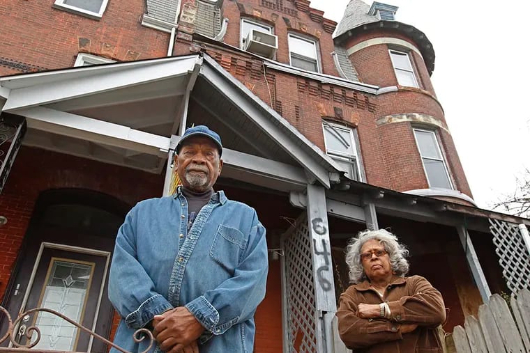 Howard Williams and Virginia Brooker live two doors down from the decrepit property on 32nd Street. ( Michael Bryant / Staff Photographer )
