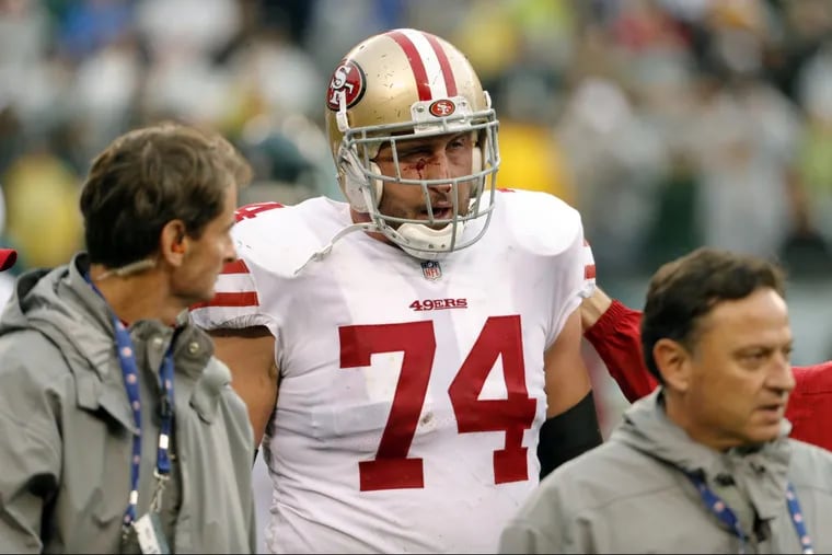 Joe Staley (74) walks off the field after getting injured during the first half Sunday.