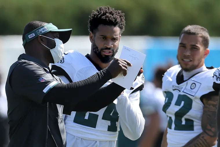 Eagles cornerback Darius Slay (center), at practice last month, said he was worried about how this season would play out.