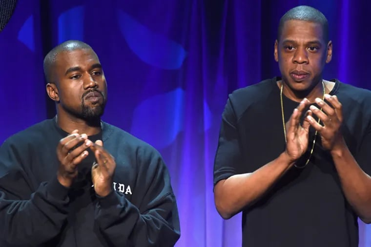 Kanye West (L) and JAY Z onstage at the Tidal launch event #TIDALforALL at Skylight at Moynihan Station on March 30, 2015 in New York City.