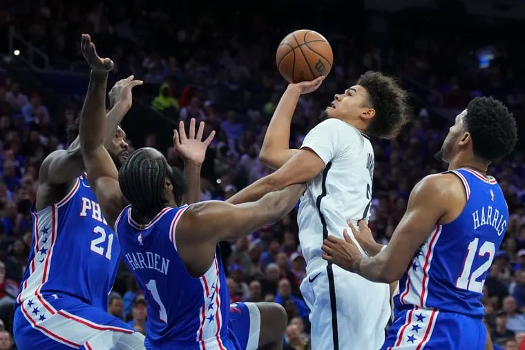 The Philadelphia 76ers' defense limited the Brooklyn Nets to 101 and 84 points in winning the first two games of a best-of-7 playoff series. The Nets are projected to score 102.5 points when the series shifts to Brooklyn for Game 3 on Thursday. (Photo by Mitchell Leff/Getty Images)