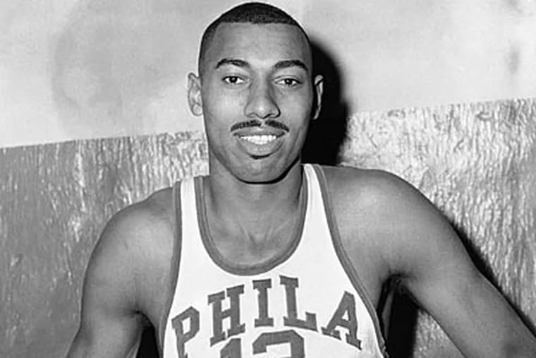 Wilt Chamberlain, shown here after scoring 100 points in a game in 1962, played in one five years later in which he didn't attempt a shot.