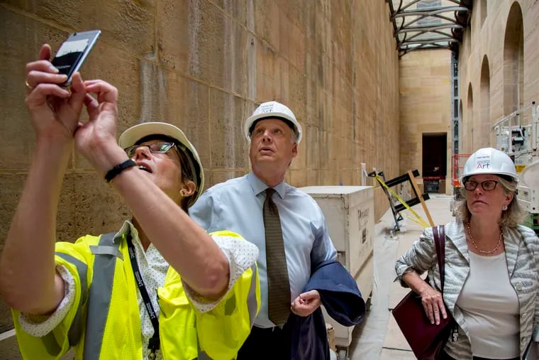Art Museum director and CEO Timothy Rub (center) and president and COO Gail Harrity (right), with capital project manager Jane Lawson-Bell, inspecting construction last summer off the museum's recently renovated and reopened Vaulted Walkway.