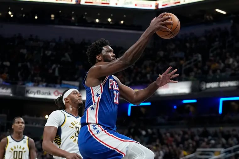 Sixers center Joel Embiid in action against the Pacers on Thursday. He was a late scratch on Saturday with left knee soreness.