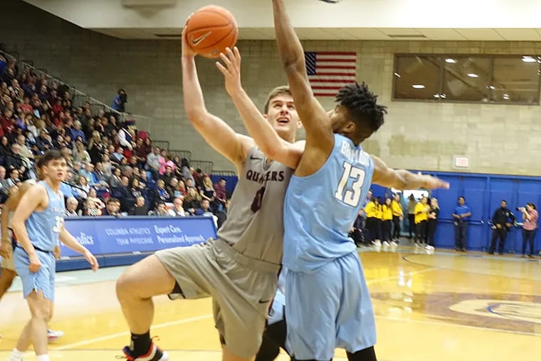 Penn's Max Rothschild draws two fouls on this hook shot in the first half vs. Columbia.