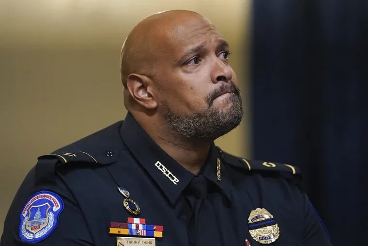 U.S. Capitol Police Officer Harry Dunn listens during a July House Select Committee hearing on the Jan. 6, 2021, attack.