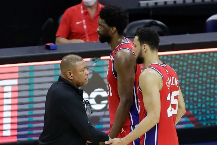 Sixers coach Doc Rivers with Joel Embiid and Ben Simmons.