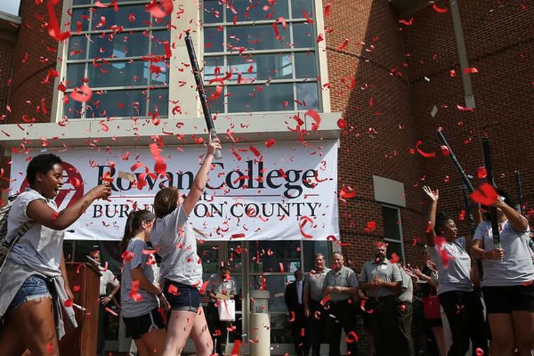 Students cheer as confetti launches during a ceremony in Mount Laurel to celebrate the changing of Burlington County College's name to Rowan College at Burlington County. (DAVID MAIALETTI / Staff Photographer)
