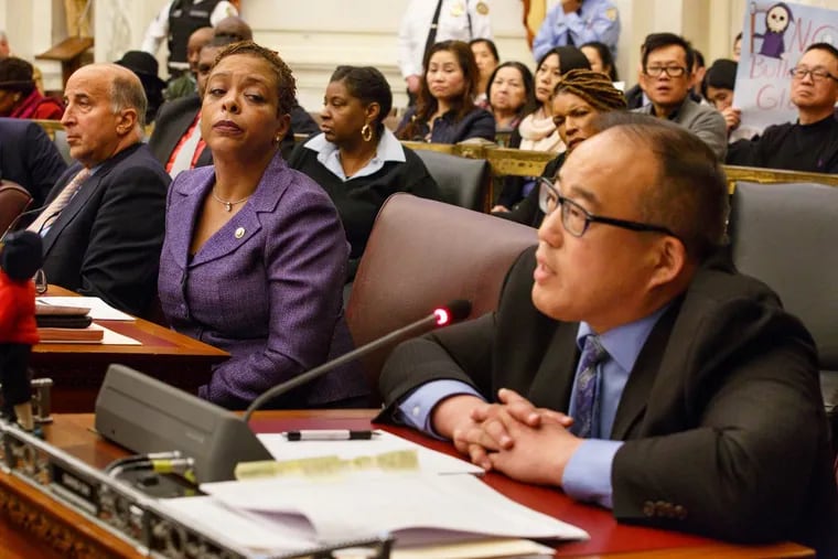 Councilwoman Cindy Bass (left) looks on as Councilman David Oh speaks during a session of City Council last year.