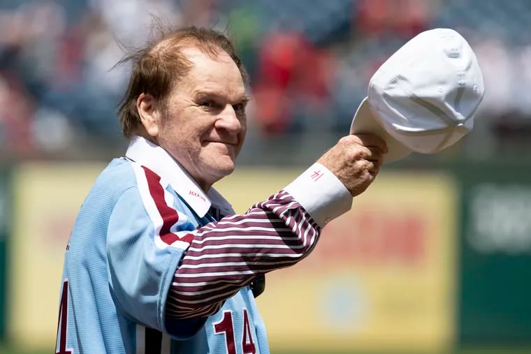 Pete Rose acknowledges fans during a ceremony honoring the 1980 Phillies World Series team on Sunday at Citizens Bank Park.