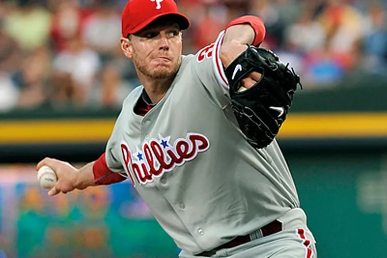Roy Halladay received his fourth win of the season Wednesday after pitching a complete game shutout against the Braves. (AP Photo/Gregory Smith)