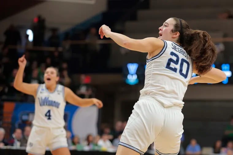 Maddy Siegrist celebrates as she watches the ball drop through the basket after scoring and getting fouled against Cleveland State.