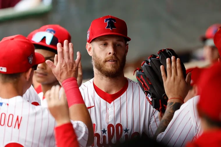 Phillies starting pitcher Zack Wheeler gets congratulated by his teammates after getting replaced in the sixth inning.